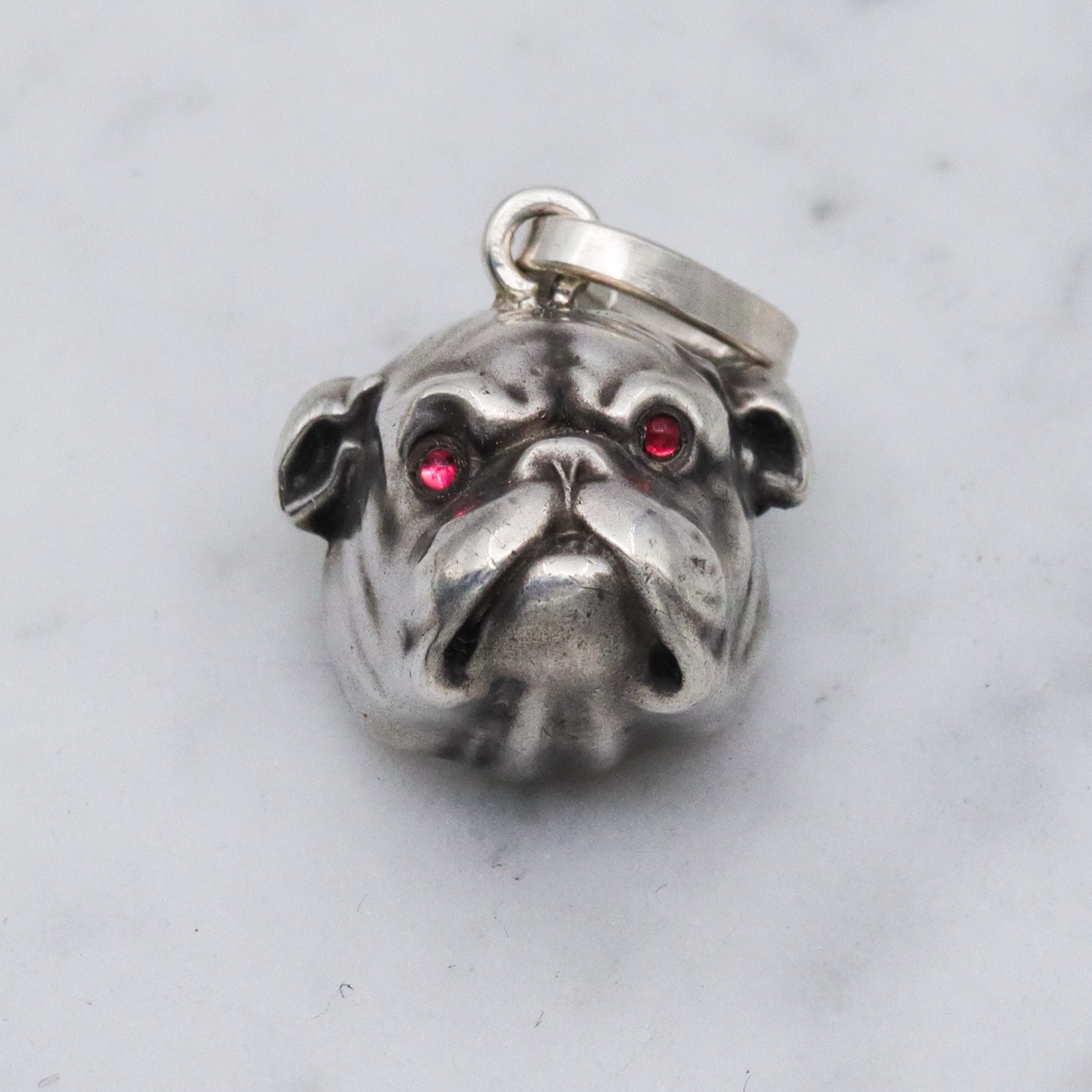 Antique Unger Brothers sterling silver bulldog with ruby glass eyes pendant